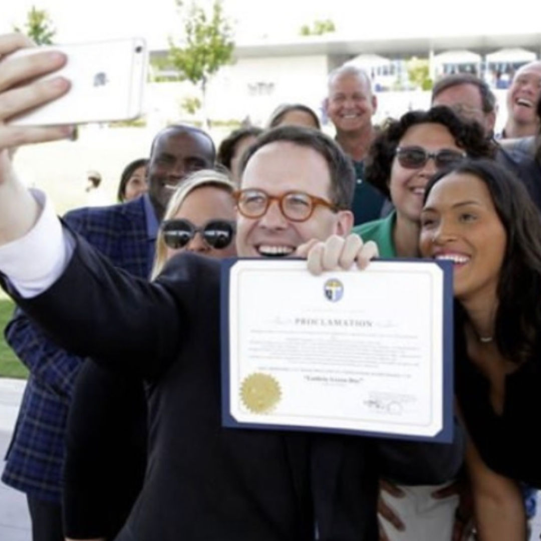 Mayor G.T. Bynum and Guthrie Green staff with certificate of declaration of Guthrie Green Day